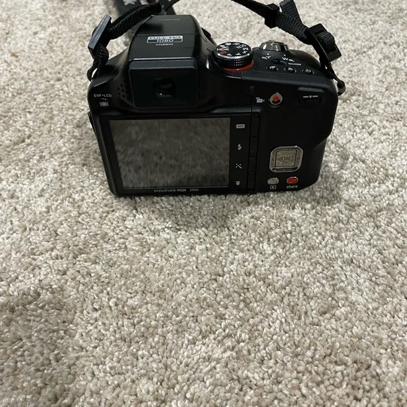 Black Kodak camera with accessories